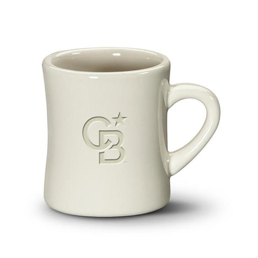 Closeup side view product image of a shiny glazed cream colored handled mug against a white background with the letters C and B and a star etched into the glaze