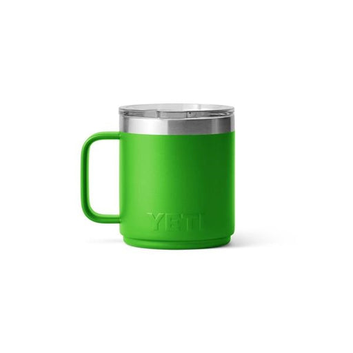 Closeup side view product image of a bright green mug with handle and silver metal at the top rim with a clear plastic lid and the word Yeti on the front